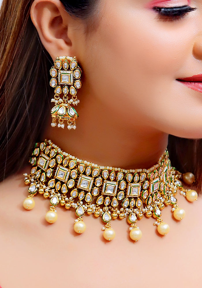 Gold Toned Kundan Choker with Pearl Droplets and a Pair of Earrings
