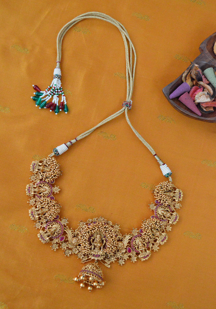 Gold Toned Temple Gold Goddess Necklace with a Pair of Jhumkis