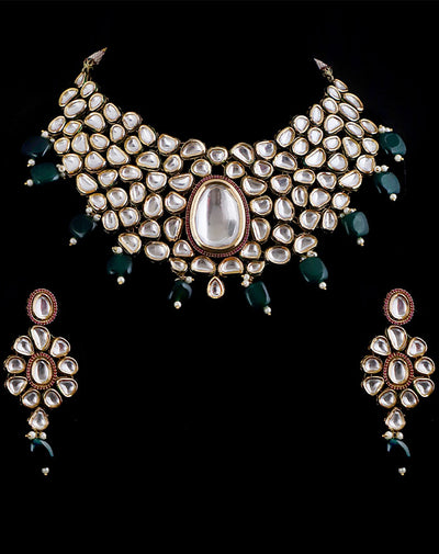 Gold Toned Kundan Necklace with Emerald Color Droplets and a Pair of Earrings